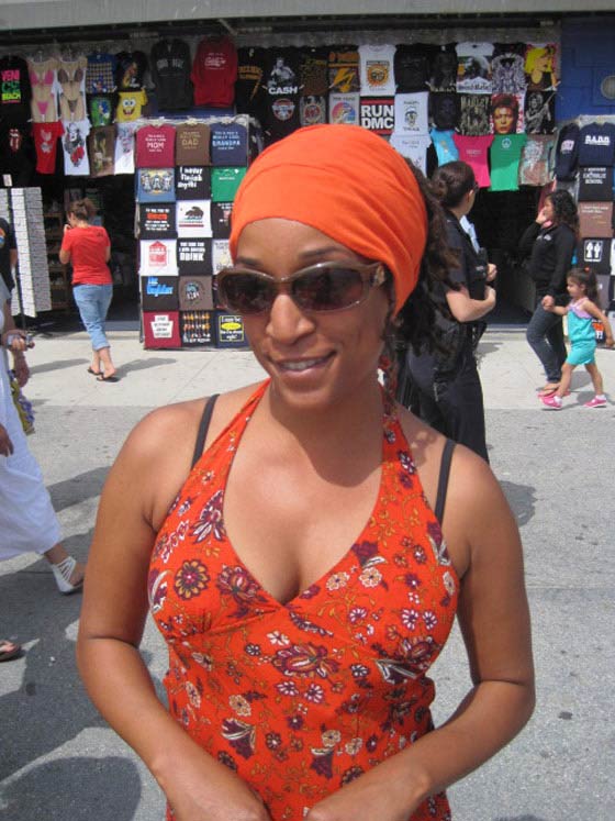 African American Woman wearing an Orange Head Wrap